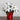 19” Artificial Lush White Poinsettia Arrangement in Red Wrapped Planter