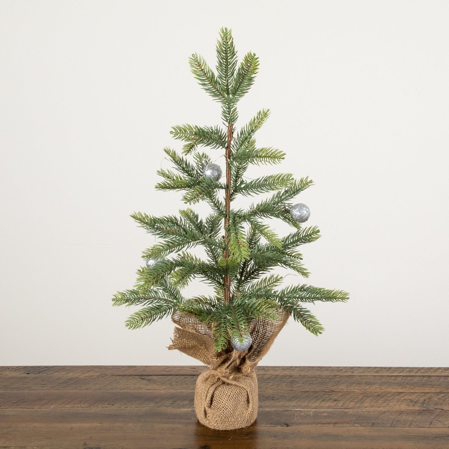 2' Pre-Lit Artificial Fraser Fir “Natural Look” Christmas Tree with 20 LED Lights and Silver Ornaments in Burlap Wrapped Base