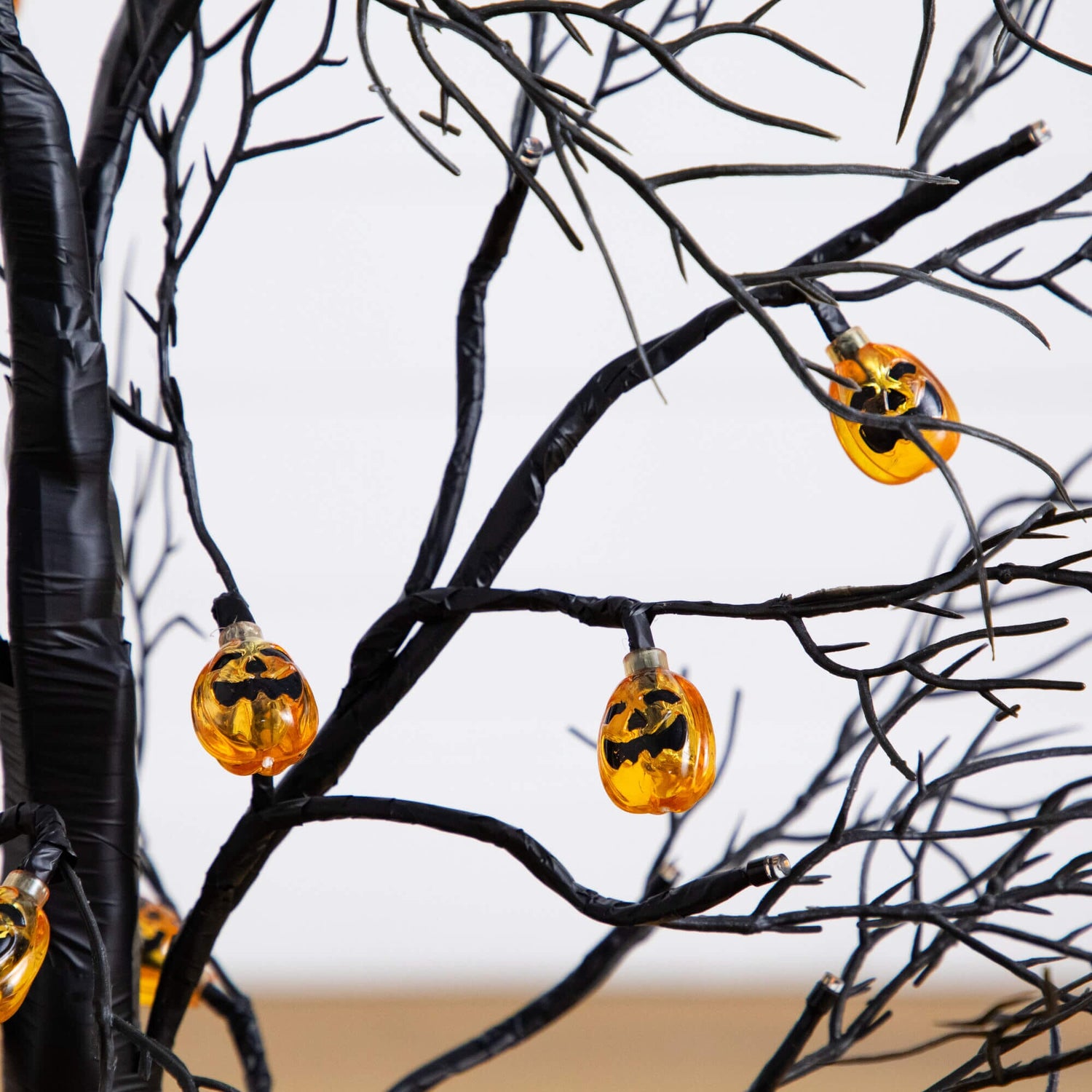 3' Pre-Lit Artificial Halloween Black Twig Tree with 18 Orange LED Pumpkin Shaped Lights