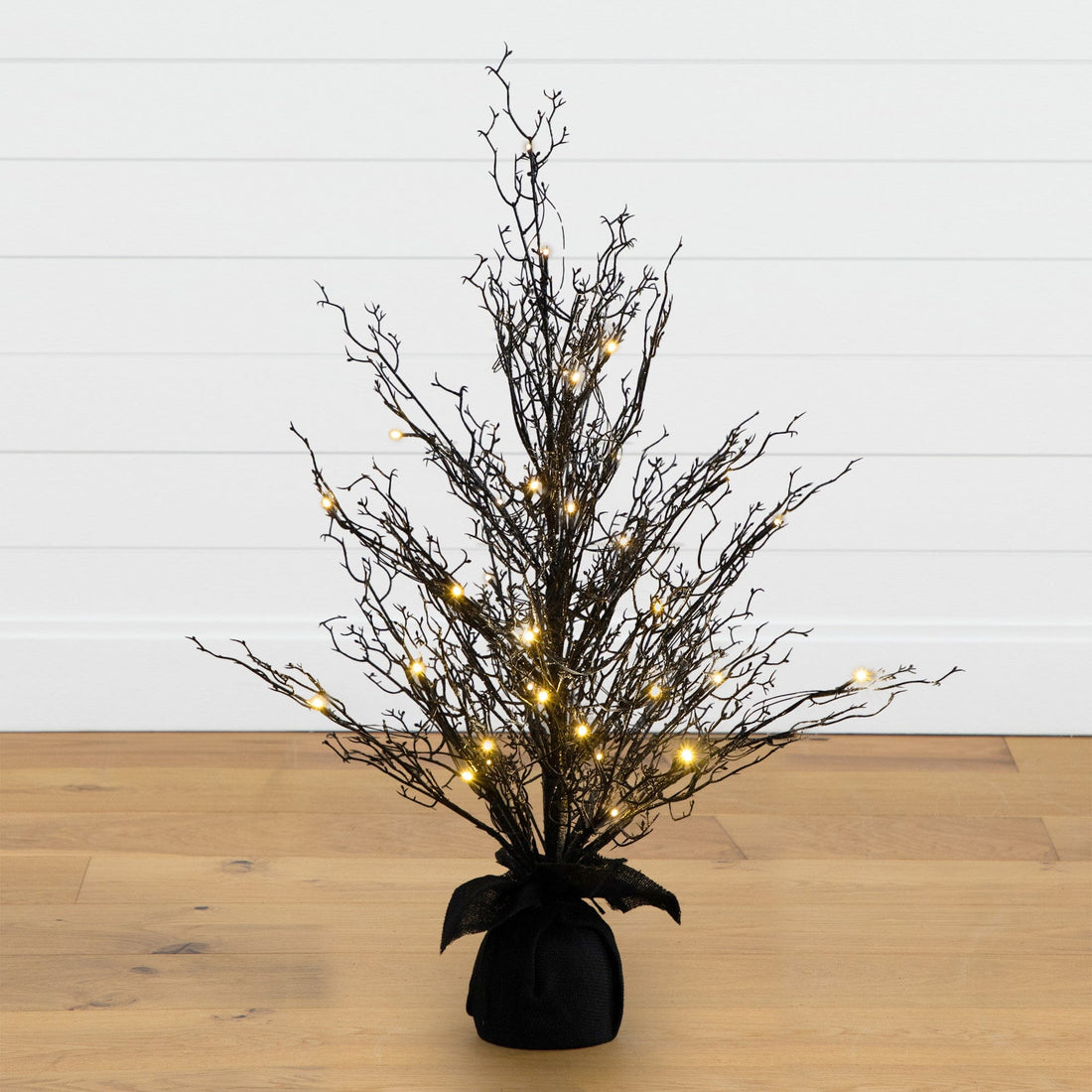 small faux plant in black pot 3' Pre-Lit Halloween Black Twig Artificial Fall Tree in Burlap Planter with  42 Warm White LED Lights