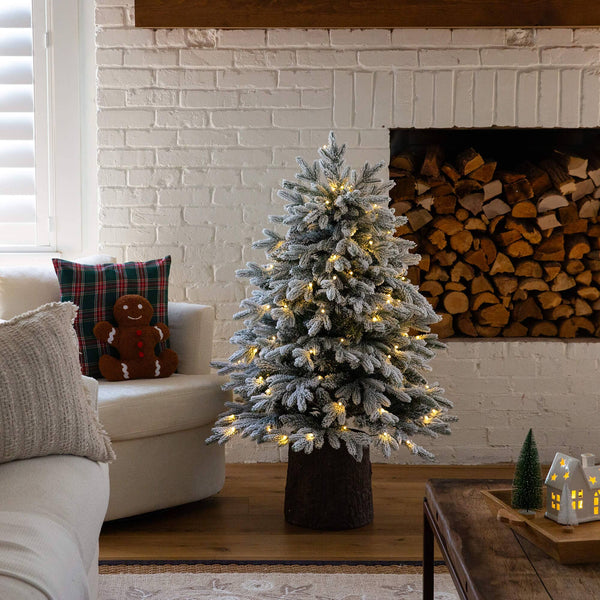 4' Pre-Lit Artificial Flocked Christmas Tree with 100 Warm White LED Lights in Decorative Trunk Planter