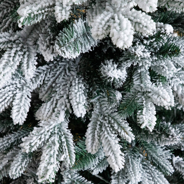4' Pre-Lit Artificial Flocked Christmas Tree with 100 Warm White LED Lights in Decorative Trunk Planter