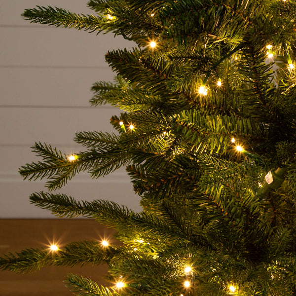 4.5' Pre-Lit Artificial Christmas Tree in Decorative Planter with 60 Clear LED Lights