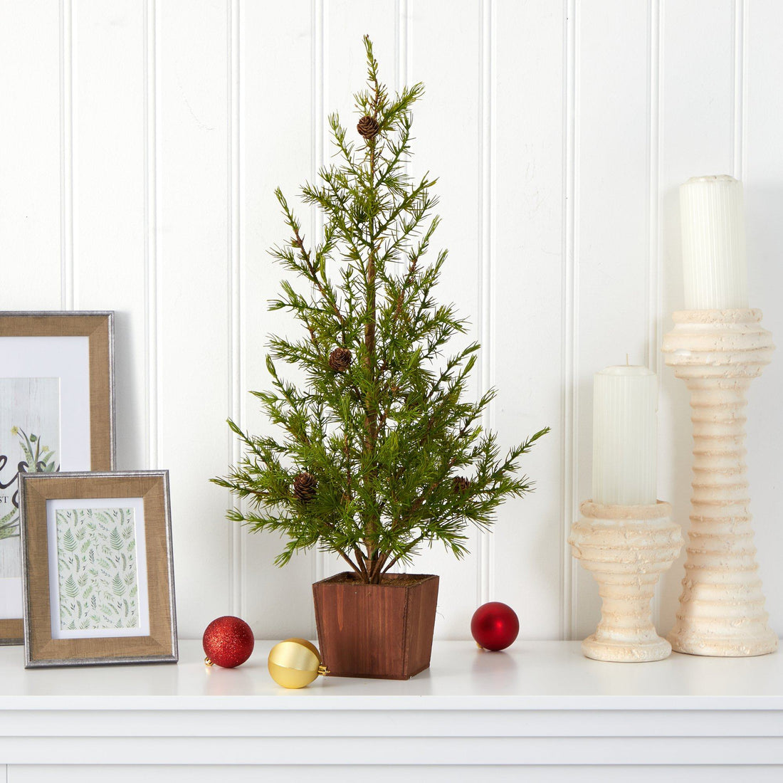house plants as christmas trees 28” Alpine “Natural Look” Artificial Christmas Tree in Wood Planter with Pine Cones