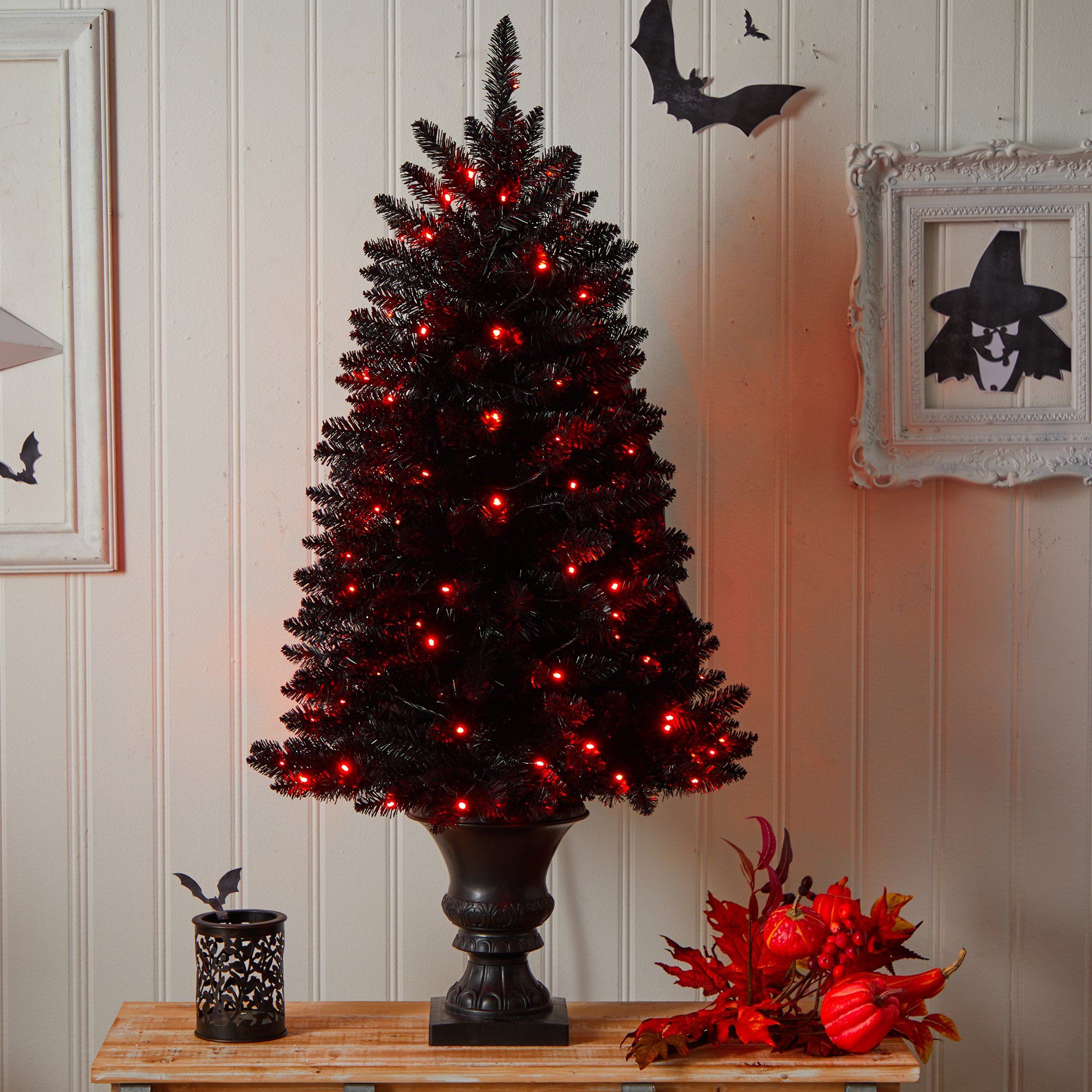 Black christmas tree shop with orange lights