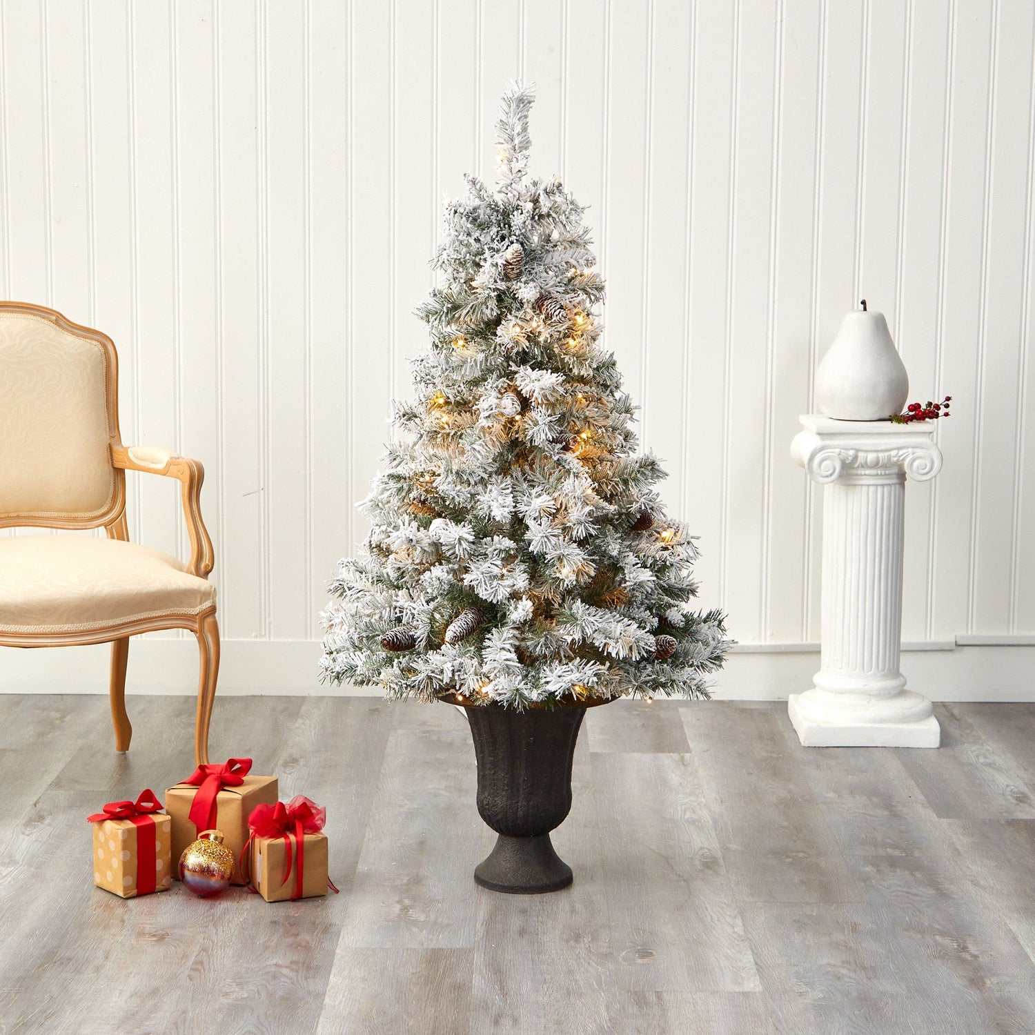 4.5' Flocked White River Mountain Pine Artificial Christmas Tree with Pinecones and 100 Clear LED Lights in Charcoal Urn